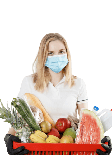 A woman holding a basket of fresh groceries
