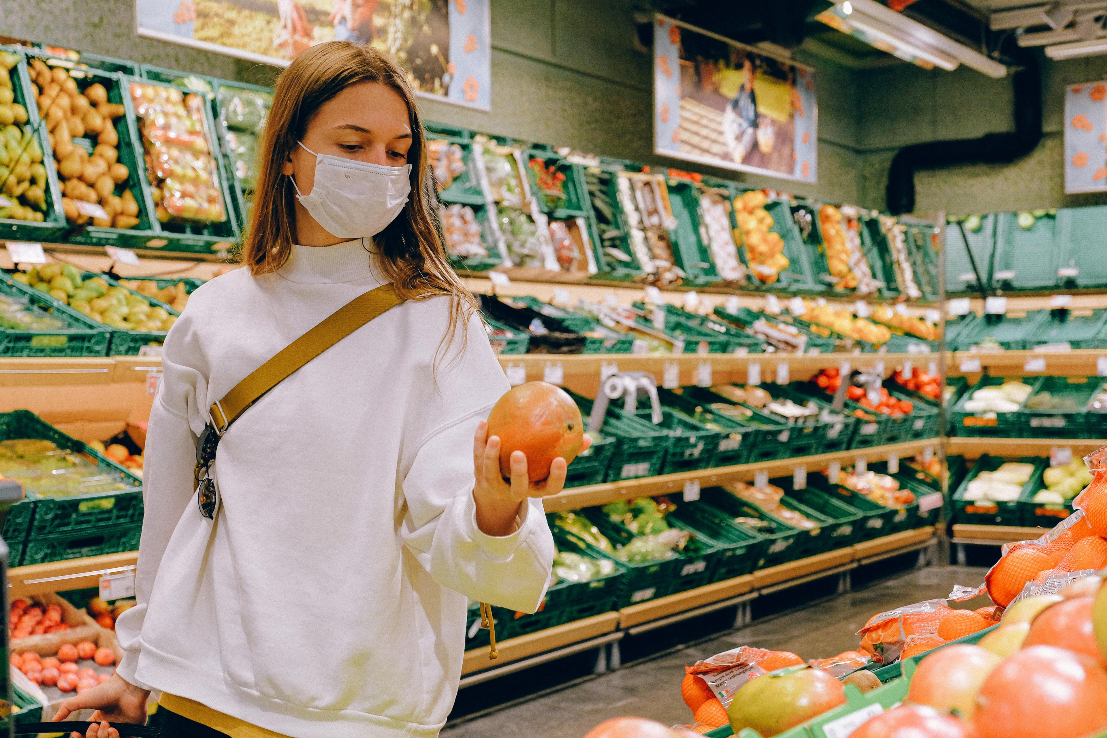 A woman shopping for fresh produce in a market